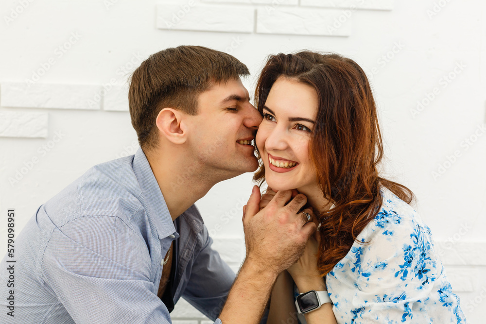 happy young couple have fun and relax in their new big bright home apartment. happy young couple have fun and relax in their new big bright home apartment.