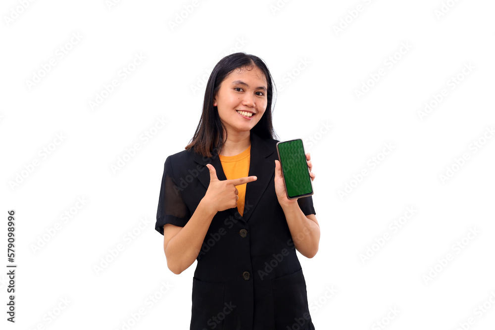 Happy young asian business woman pointing her blank cell phone display. Isolated on white