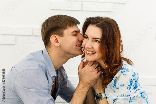 Fototapeta Naklejka Na Ścianę i Meble -  happy young couple have fun and relax in their new big bright home apartment.