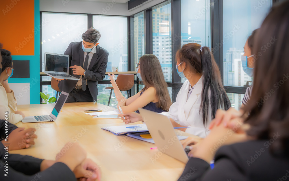 Businessman making presentation with his colleagues and business strategy digital layer effect at the office as concept. Businessman making presentation with his colleagues and business strategy digital layer effect at the office as concept.