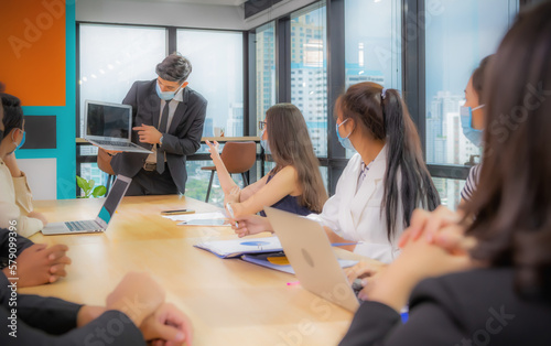 Businessman making presentation with his colleagues and business strategy digital layer effect at the office as concept.