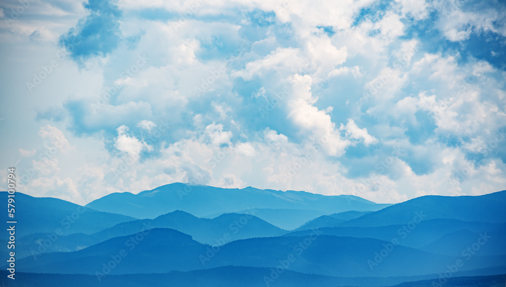 Mountains under mist and white clouds in the morning in the Carpathian mountains, Ukraine, Europe Mountains under mist and white clouds in the morning in the Carpathian mountains, Ukraine, Europe