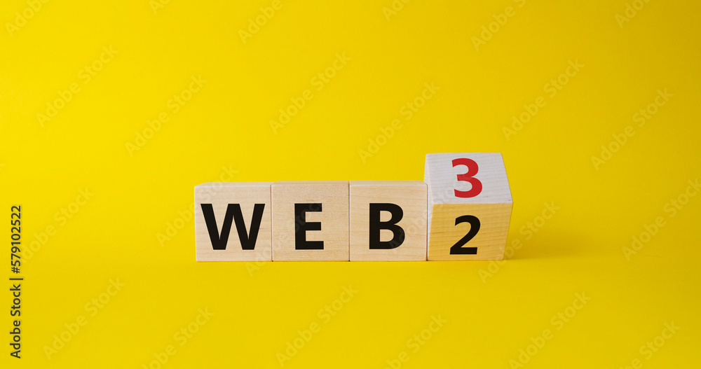 Web 3 vs Web 2 symbol. Turned wooden cubes with words web 2 vs web 3. Beautiful yellow background. Business concept. Copy space