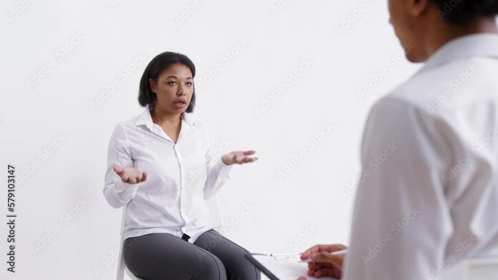 Young woman talking with psychologist on white background, virtual doctor, dream