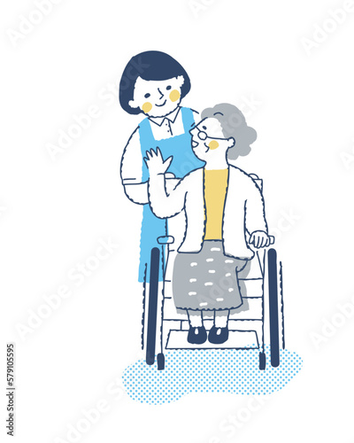  車いすのシニア女性と介護スタッフ