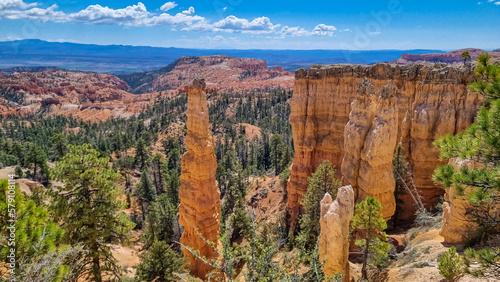 Scenic aerial view of Boat Mesa and massive hoodoo wall sandstone rock formation on Fairyland hiking trail in Bryce Canyon National Park, Utah, USA. Unique nature in barren landscape. Clouds emerging