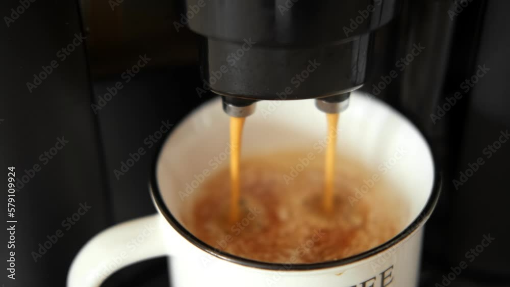 Espresso Pouring from Coffee Machine into a White Cup. Preparing Fresh Black Americano. Morning Coffee Preparation Concept. Professional Coffee Brewing. Electric Automatic Kitchen Coffee-Maker. 4K
