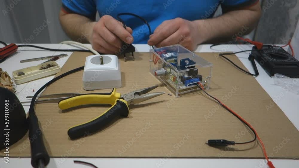 Man solder repairs electronics Man solder repairs electronics