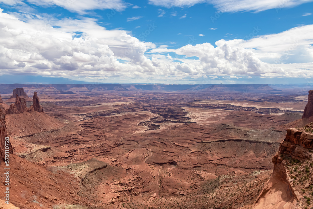 Panoramic view on Buck Canyon seen from Mesa Arch near Moab, Canyonlands National Park, San Juan County, Southern Utah, USA. Looking at natural pothole arch rock formation near Island in the Sky Mesa