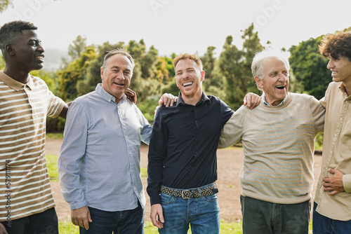 Multi generational men having fun together at city park - Multiracial male friends enjoy day outdoor © Sabrina