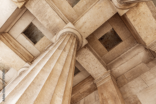 Antique stone column of a old building close-up.