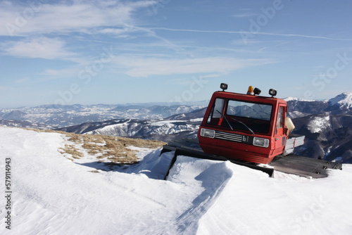 Stationary snowplow on Mount Cimone peak