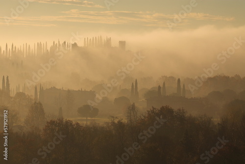 paesaggio con nebbia sul lago di Garda photo