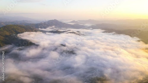 Aerial fly drone hyperlapse foggy or the clouds while sunrise sky, sea of mist mount nature.