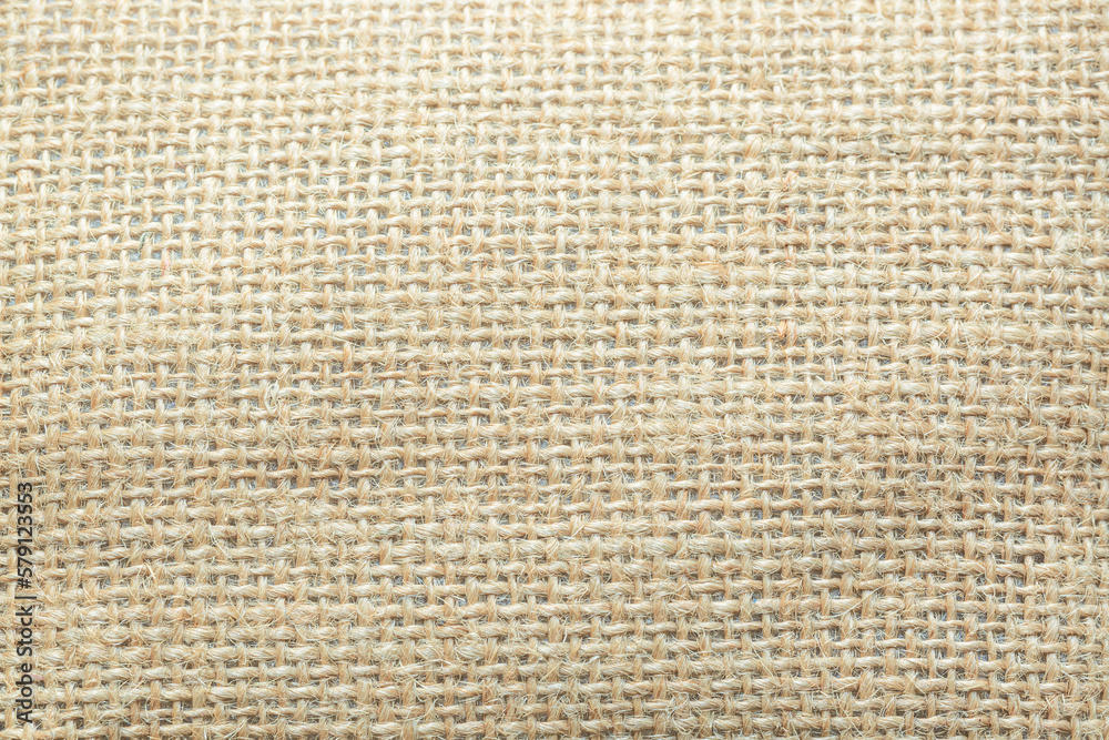 Texture of natural burlap material close-up, with natural folds and draperies Texture of natural burlap material close-up, with natural folds and draperies
