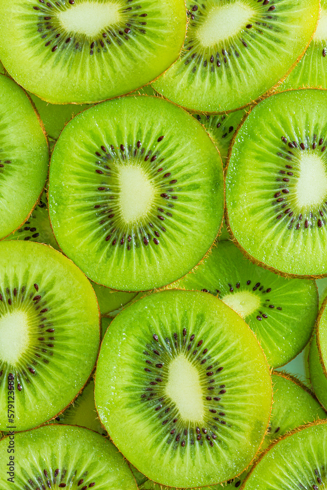 macro kiwi background,macro kiwi,Kiwi fruit pattern. Healthy food background, overhead. macro kiwi background,macro kiwi,Kiwi fruit pattern. Healthy food background, overhead.