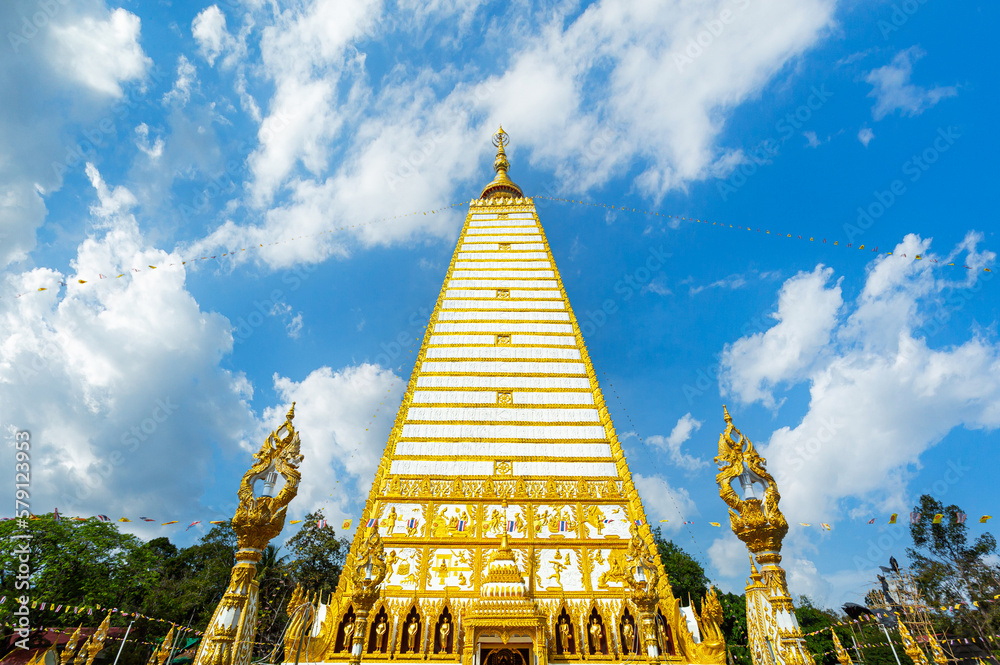 Fototapeta premium Beautiful golden Pagoda at Wat Phrathat Nong Bua ancient Temple in Ubon Ratchathani,Thailand. Public Domain