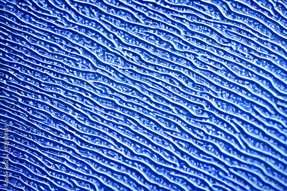 Textura azul com listras assimétricas em relevo Textura azul com listras assimétricas em relevo