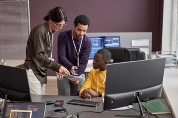Group of business people collaborating on project in IT development office