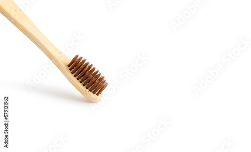 Eco-friendly wooden toothbrush. Close-up  white background  copy space.
