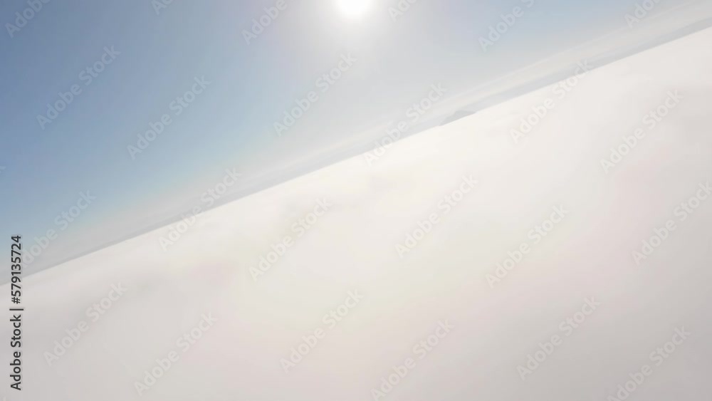 Air view. Flying low above the clouds on an unmanned fpv glider. Cloud surfing. Gliding over a low cloudy surface. cloud background Air view. Flying low above the clouds on an unmanned fpv glider. Cloud surfing. Gliding over a low cloudy surface. cloud background