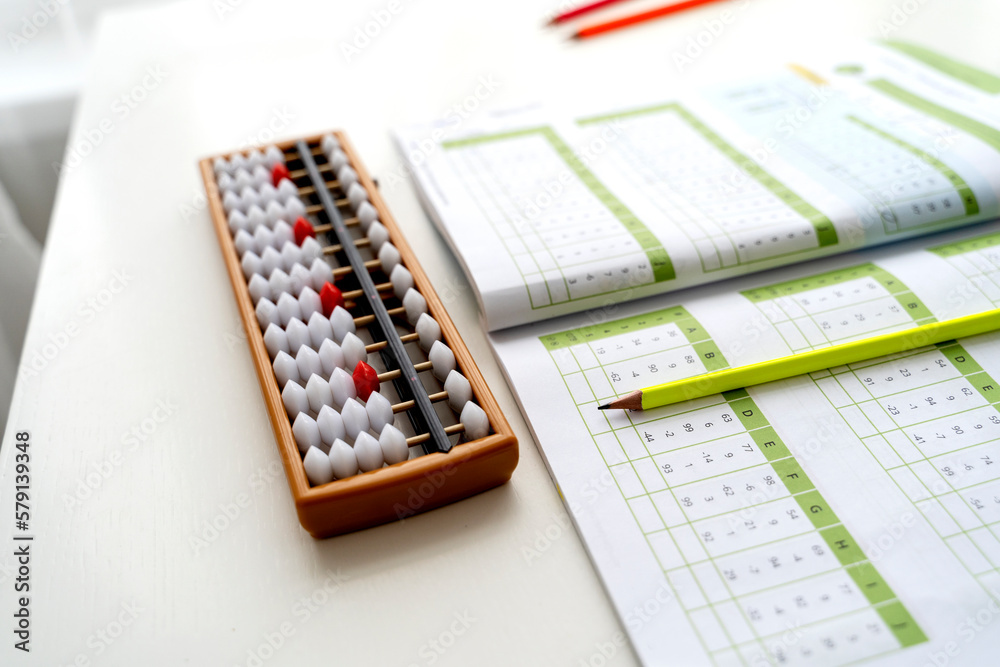 The boy is engaged in abacus, mental arithmetic for children The boy is engaged in abacus, mental arithmetic for children