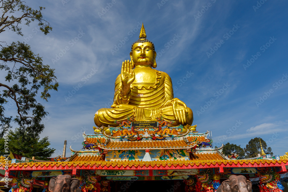 Mueang Nakhon Nayok District Nakhon Nayok Province, Thailand - 23 October 2022 : Golden Buddha statue meditating At Maneewong Temple