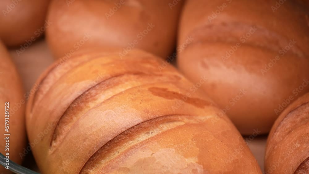 Fresh bread on the shelves of the bakery in the supermarket. Shopping at the grocery store. Selling food concept. Fresh bread on the shelves of the bakery in the supermarket. Shopping at the grocery store. Selling food concept.