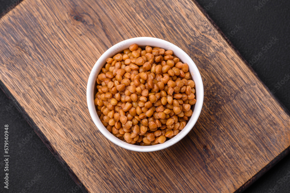 Delicious healthy canned lentils in a ceramic ribbed white bowl Delicious healthy canned lentils in a ceramic ribbed white bowl