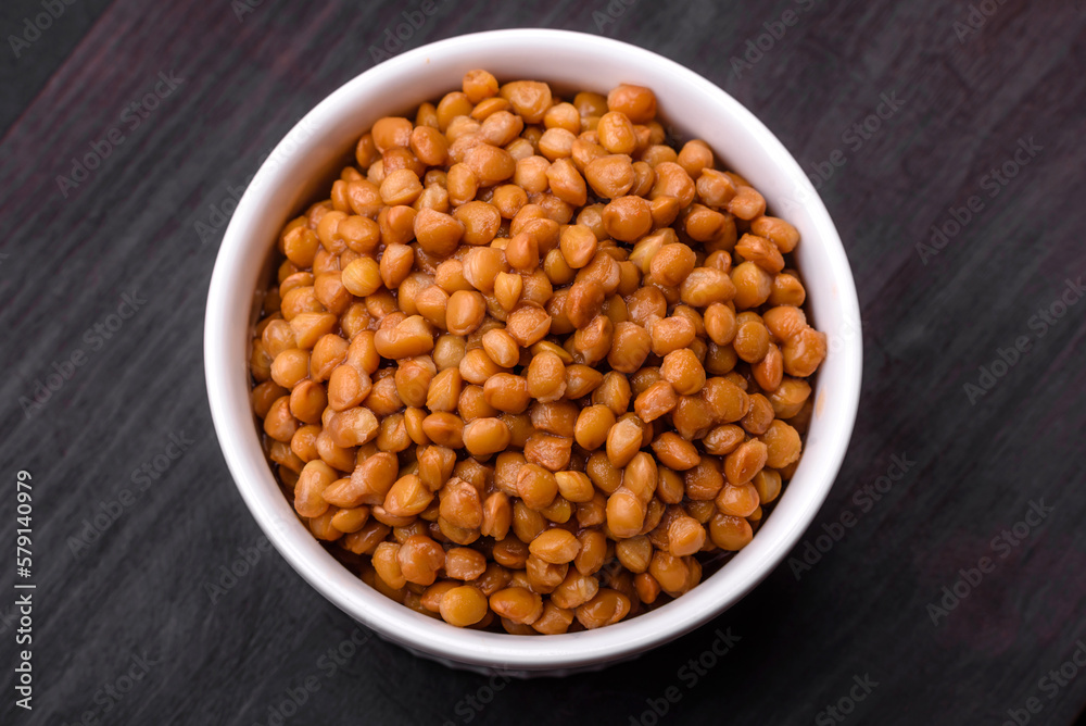 Delicious healthy canned lentils in a ceramic ribbed white bowl