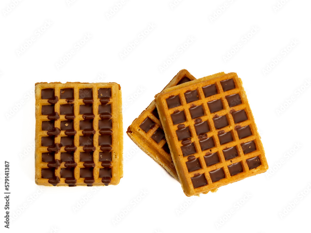 Chocolate waffles isolated on white background. Waffles in chocolate. Close-up. Chocolate waffles isolated on white background. Waffles in chocolate. Close-up.