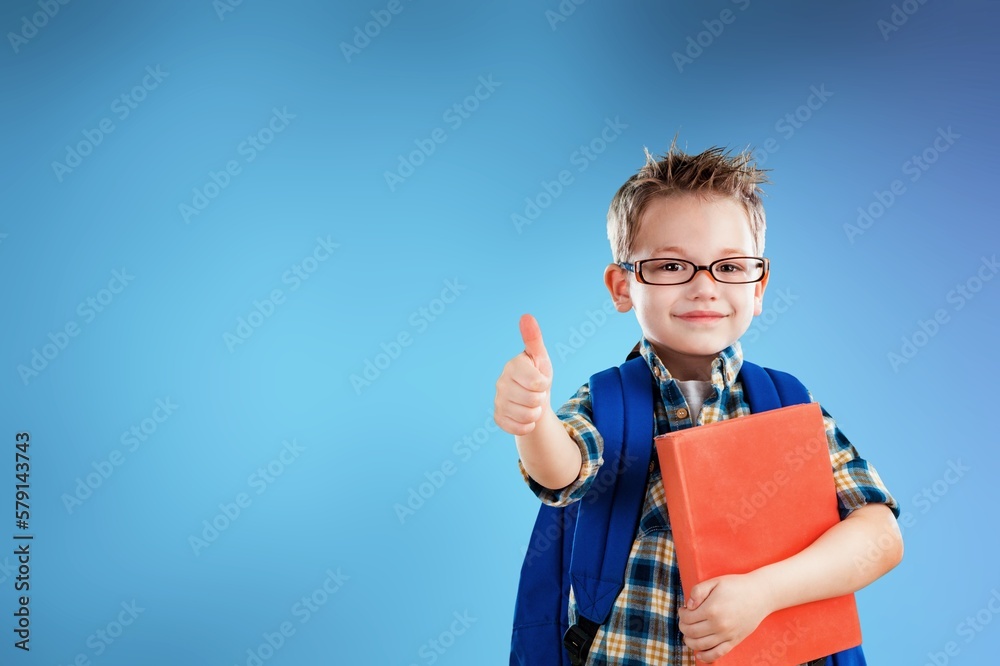 Smiling young child student posing