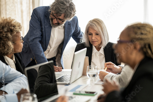 Фотография group of business people of different ages at the meeting - multiracial people w