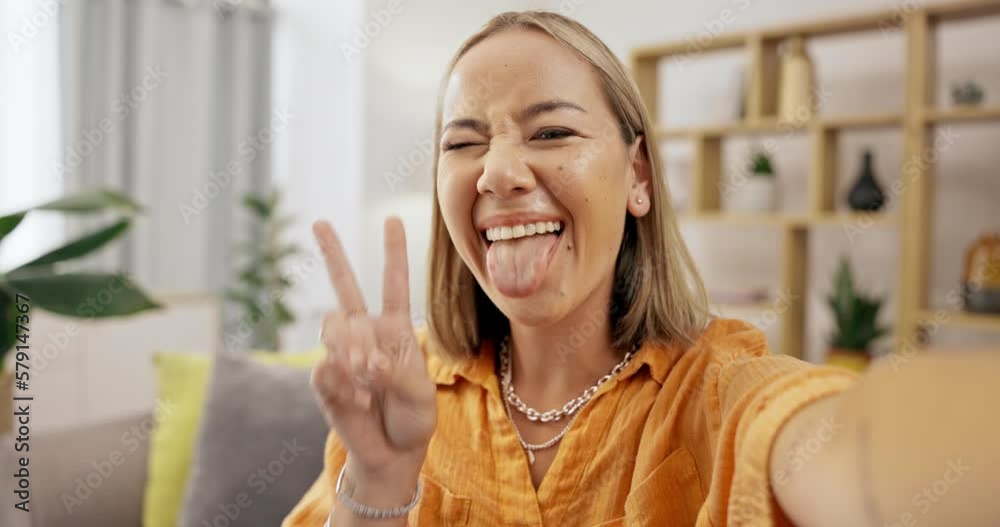Selfie, home and face of a young gen z woman on a living room sofa with peace and emoji sign. Kiss, photo and portrait of a female on a lounge couch taking a image for social media profile picture