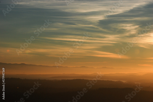 Hazy or smoky sunset over the south of Vancouver Island with the Olympic Peninsula in the distance.