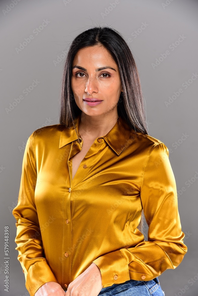 Studio images of beautiful Asian Indian woman in gold blouse. Studio images of beautiful Asian Indian woman in gold blouse.