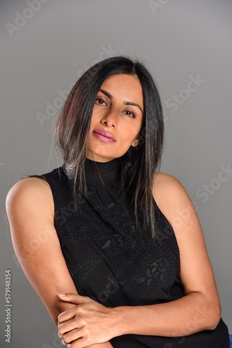 Studio images of beautiful Asian, Indian woman in casual clothes. 
