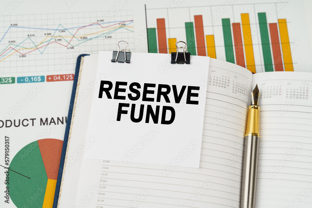On the business charts is a notepad with the inscription - Reserve Fund
