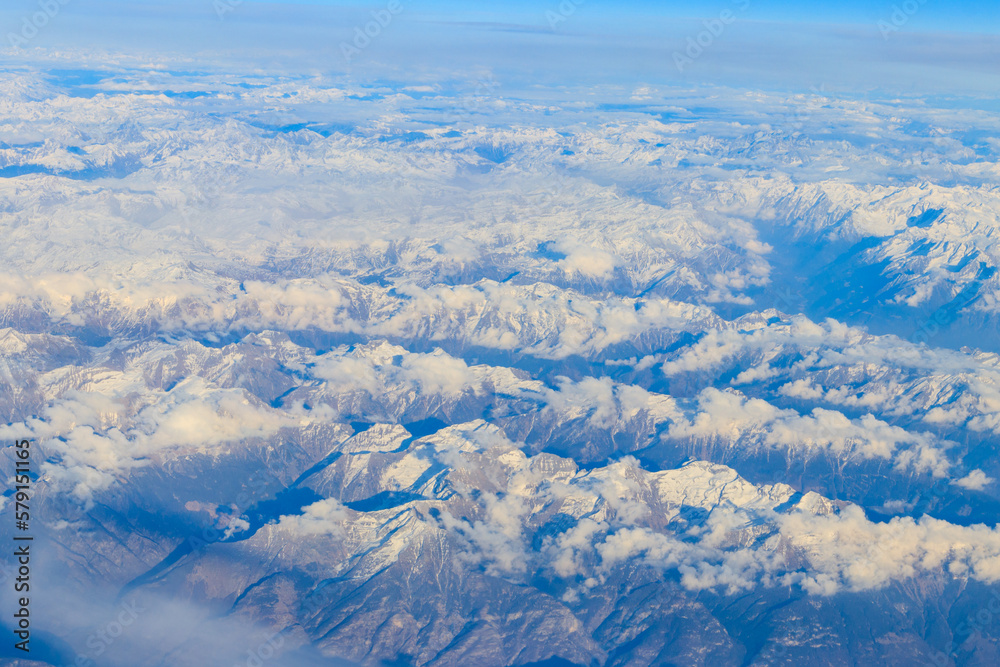 View of the Swiss Alps covered with snow from airplane