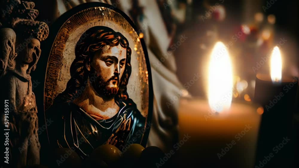 Cinemagraph of The image of Christ on the decoration beside the lighted candle Cinemagraph of The image of Christ on the decoration beside the lighted candle