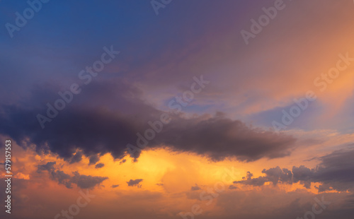 Fototapeta Naklejka Na Ścianę i Meble -  Orange and blue colored dramatic sunset sky.