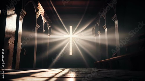 The big cross on the wall of the church with the yellow light getting in