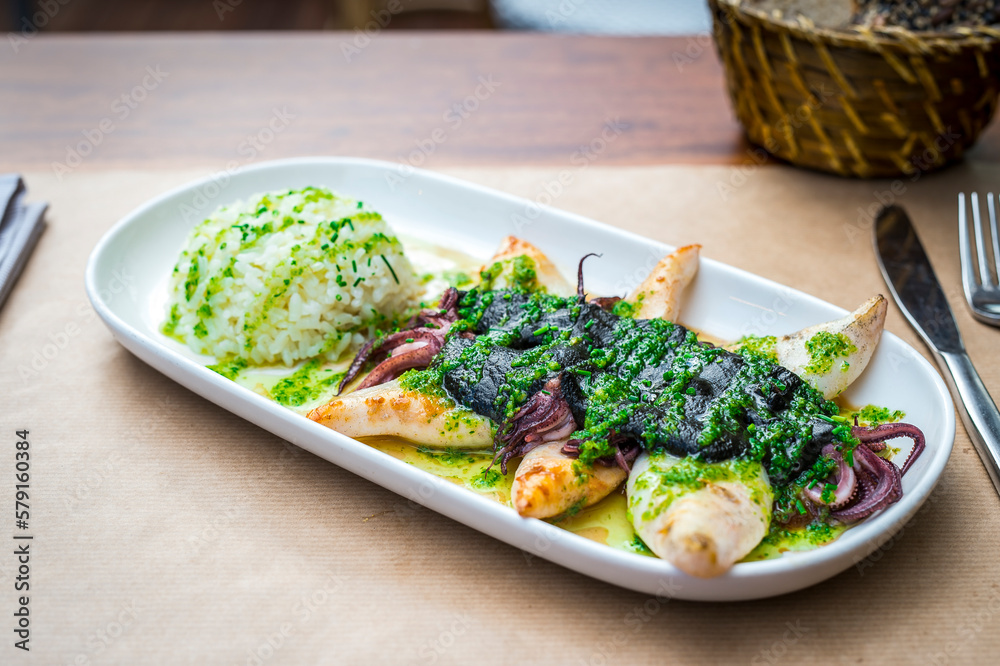 grilled squid with rice, typical Spanish dish