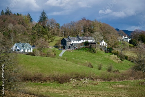 Beautiful forest landscape with houses in the mountains in Little Langdale near Coniston lake