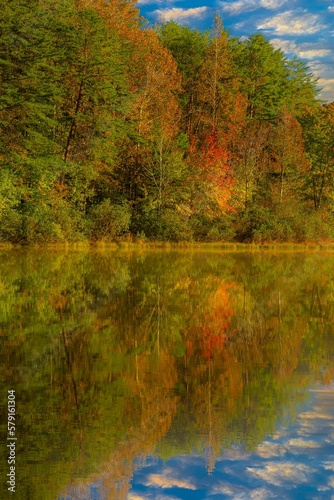 Shorts Lake is surrounded by hardwood trees showing fall color, in Crowders Mountain State park, North