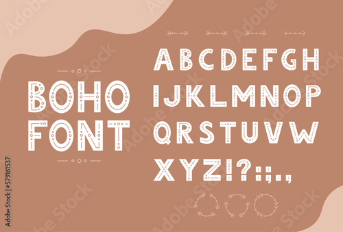 Cute hand drawn boho font with latin alphabet and decorative elements.