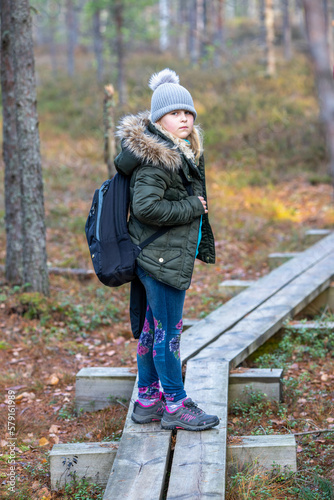 The girl is on a hike in a wild swamp. Nordic girl. © Allan