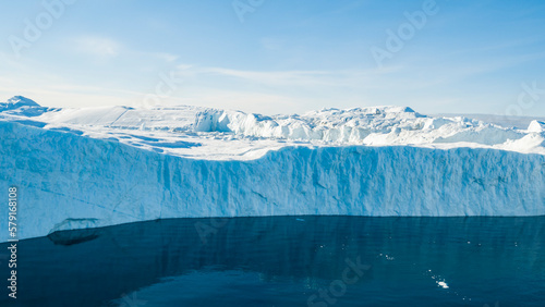 Giant iceberg. Global warming and climate change concept. Icebergs in Disko Bay on greenland in Ilulissat icefjord from melting glacier Sermeq Kujalleq Glacier, Jakobhavns Glacier. Aerial drone image