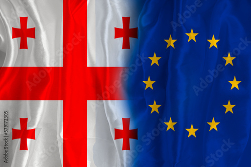 Georgian flag and EU flag. Flag of the country of Georgia and the European Union together. Conceptual image of Georgia and the European Union.