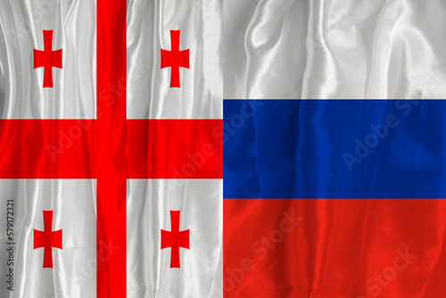 Georgian flag and EU flag. Flag of the country of Georgia and the European Union together. Conceptual image of Georgia and the European Union.